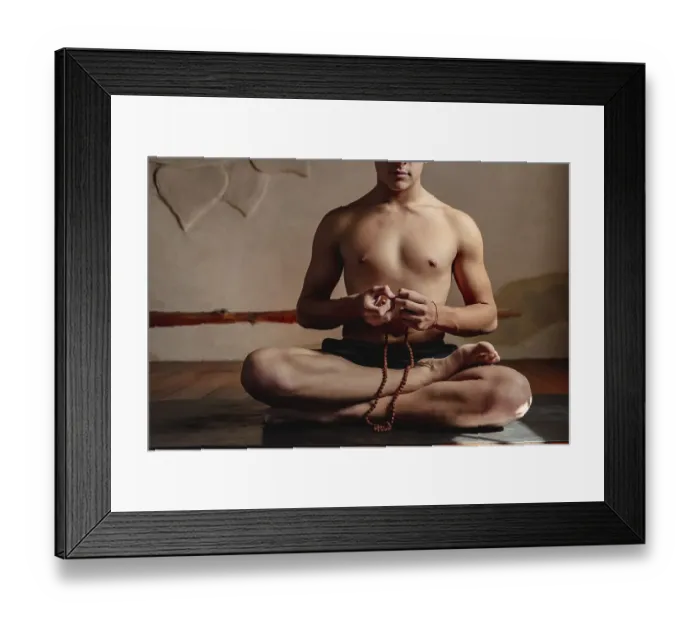 Framed Print : Young unrecognizable man meditating with a rudraksha mala in his hands