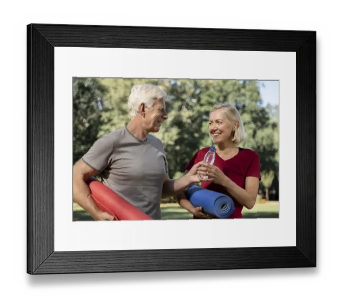 Framed Print : Smiley older couple outdoors with yoga mats water bottle Framed Print : Smiley older couple outdoors with yoga mats water bottle