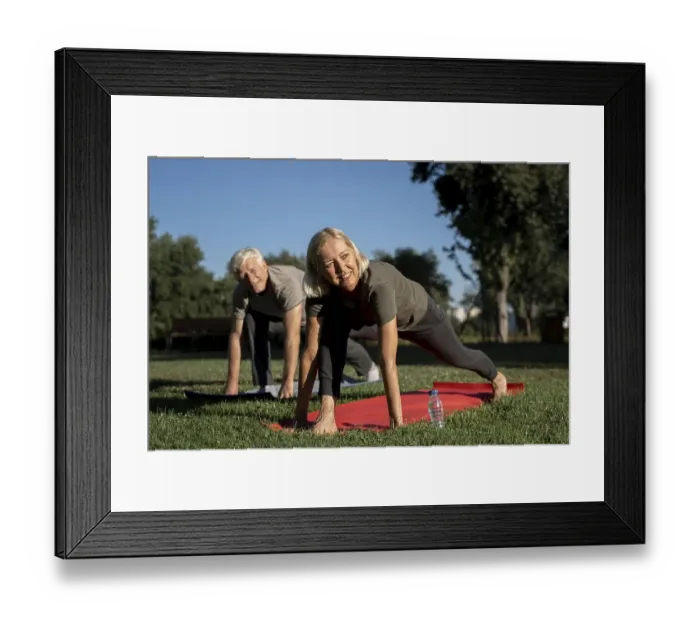 Framed Print : Smiley elder couple practicing yoga outdoors