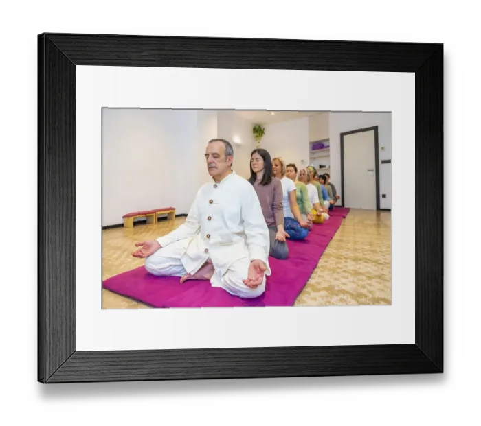 Framed Print : Yoga teacher leading a group of women meditating in line in lotus position and eyes closed Framed Print : Yoga teacher leading a group of women meditating in line in lotus position and eyes closed