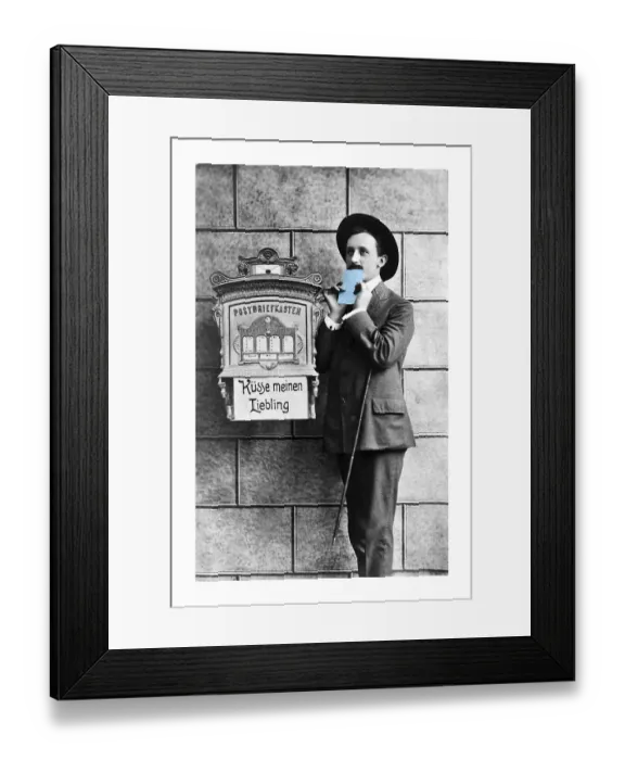 Framed Print : Man kissing a light blue love letter in front of a mailbox