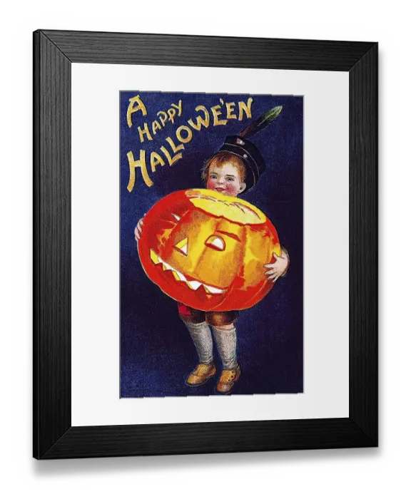 Framed Print : Boy holding a carved pumpkin or Jack-o-lantern in his arms