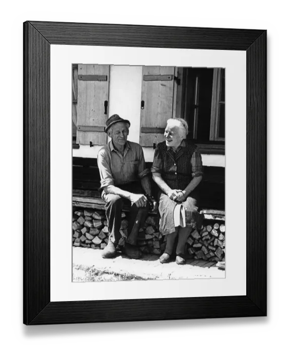 Framed Print : Old happy couple on the house bank in front of the farm Framed Print : Old happy couple on the house bank in front of the farm