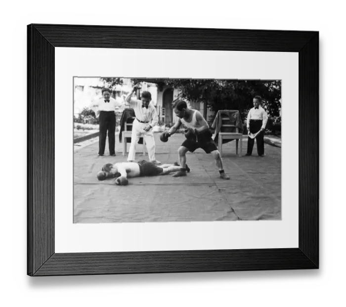 Framed Print : Lilliputian at boxing, one goes KO