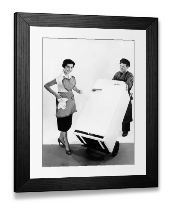 Framed Print : Housewife and supplier, a new refrigerator is delivered Framed Print : Housewife and supplier, a new refrigerator is delivered