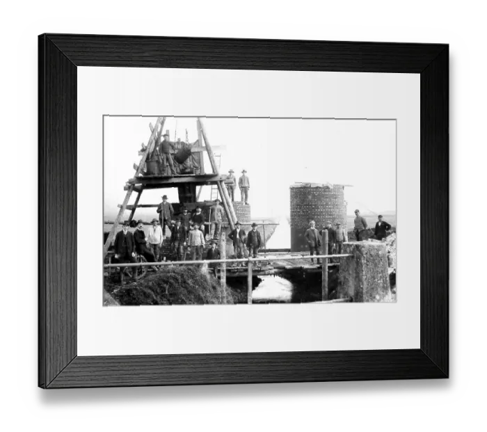 Framed Print : Construction site, masons building a factory