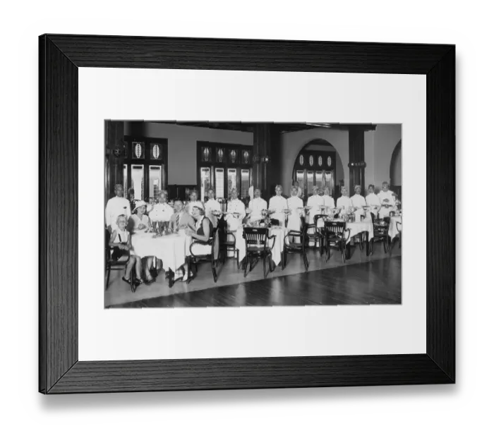 Framed Print : Colonial history, waiters take care of a family of four in the restaurant