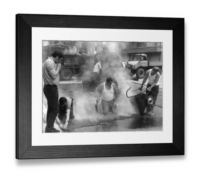 Framed Print : Road workers take tar to the streets