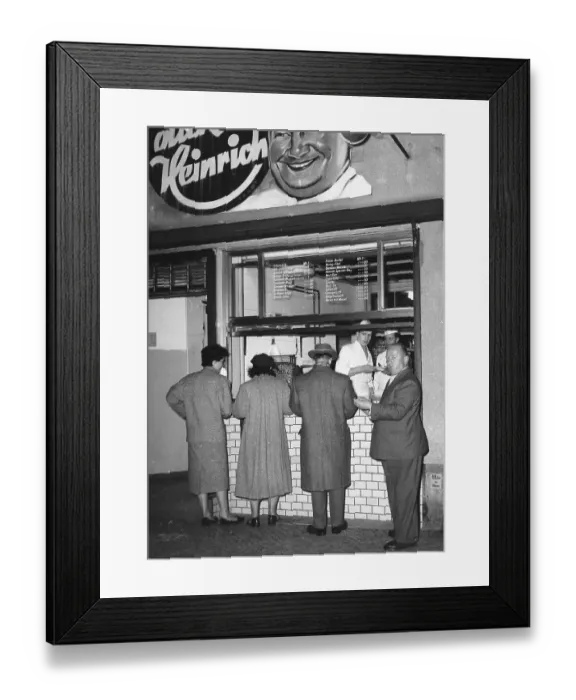 Framed Print : Men and women eat sausages, 1960s