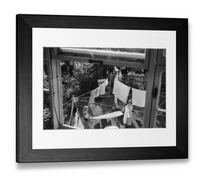 Framed Print : Two housewives hanging up laundry