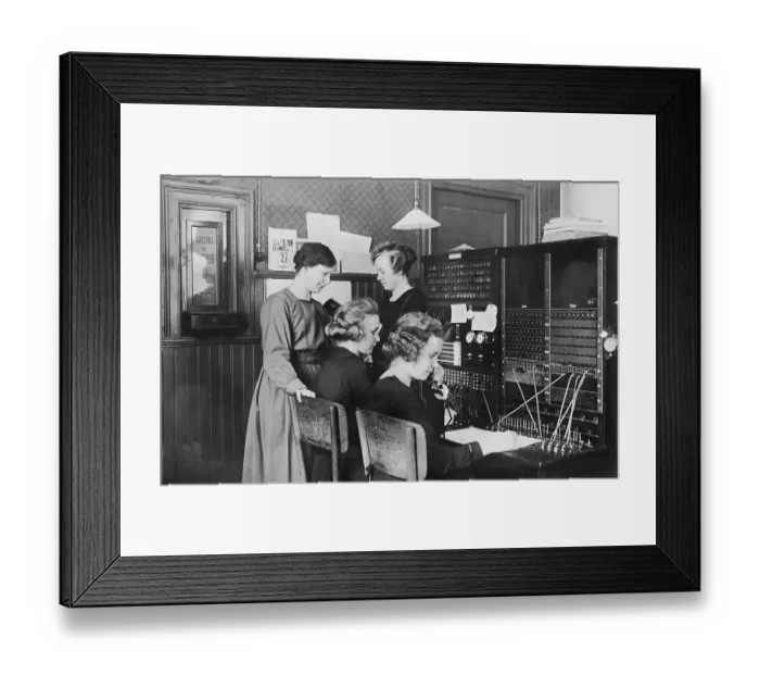 Framed Print : Telephone operators, women working in a switchboard