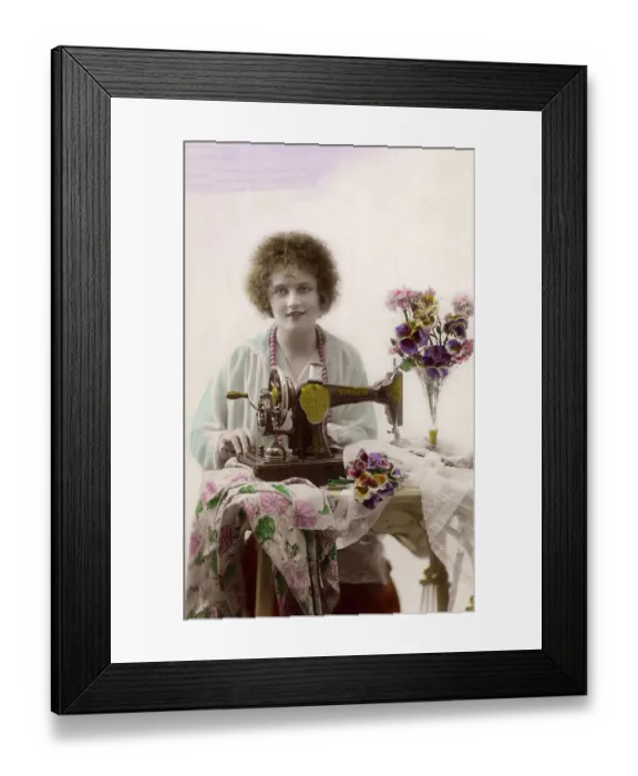 Framed Print : Woman sewing with sewing machine Framed Print : Woman sewing with sewing machine