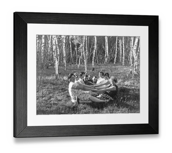 Framed Print : Group in the forest holding hands