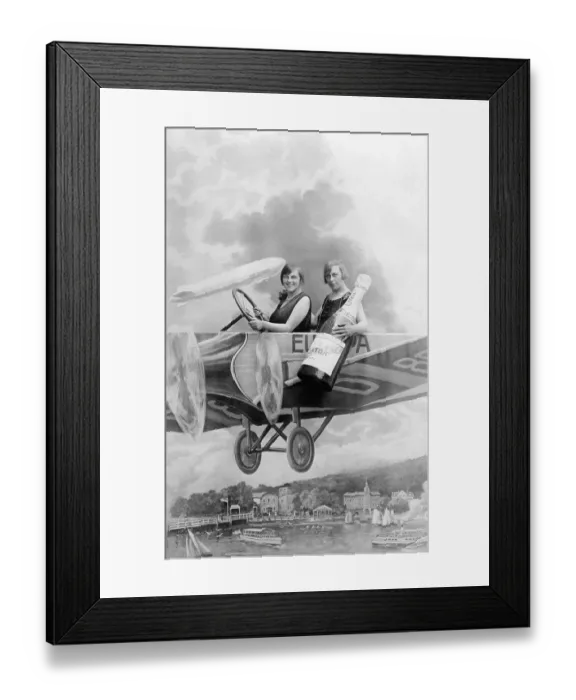 Framed Print : Two women with a bottle of sparkling wine in an aircraft mock-up Framed Print : Two women with a bottle of sparkling wine in an aircraft mock-up