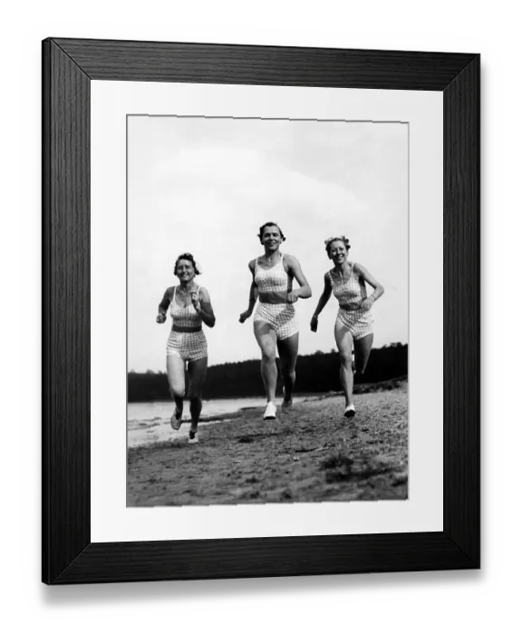 Framed Print : Three women jogging on the beach