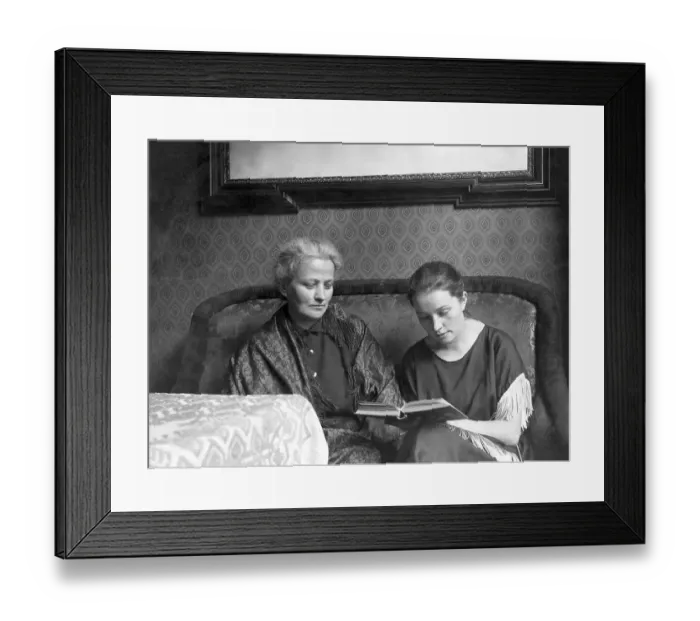 Framed Print : Mother and daughter reading a book Framed Print : Mother and daughter reading a book