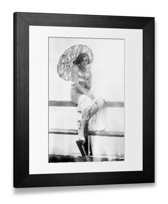 Framed Print : Holiday, woman with parasol and swimsuit at the jetty