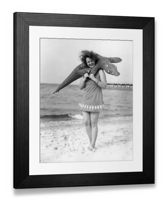 Framed Print : Swimwear, woman with swimsuit and inflatable crocodile on the beach