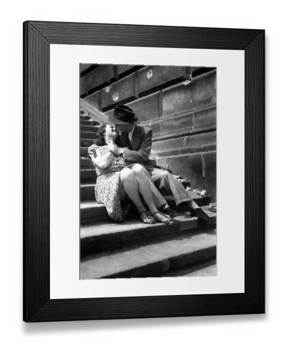Framed Print : Couple, Lovers, man kissing woman on the stairs Framed Print : Couple, Lovers, man kissing woman on the stairs