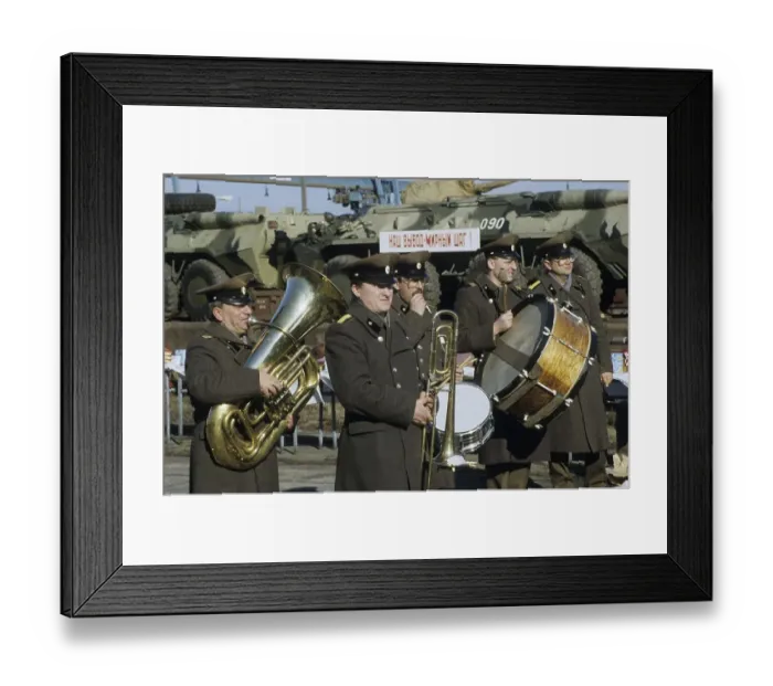 Framed Print : Russian military band playing in front of a train transporting armoured vehicles during the withdrawal of Soviet troops Framed Print : Russian military band playing in front of a train transporting armoured vehicles during the withdrawal of Soviet troops