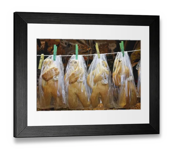 Framed Print : German advent cakes wrapped in plastic hanging on the clothesline Framed Print : German advent cakes wrapped in plastic hanging on the clothesline