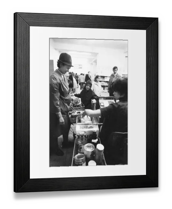 Framed Print : The work of a housewife and mother shopping for groceries at the supermarket and Aldi