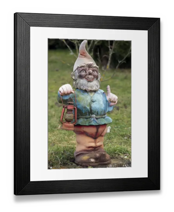 Framed Print : Garden gnome with lantern in a garden Framed Print : Garden gnome with lantern in a garden