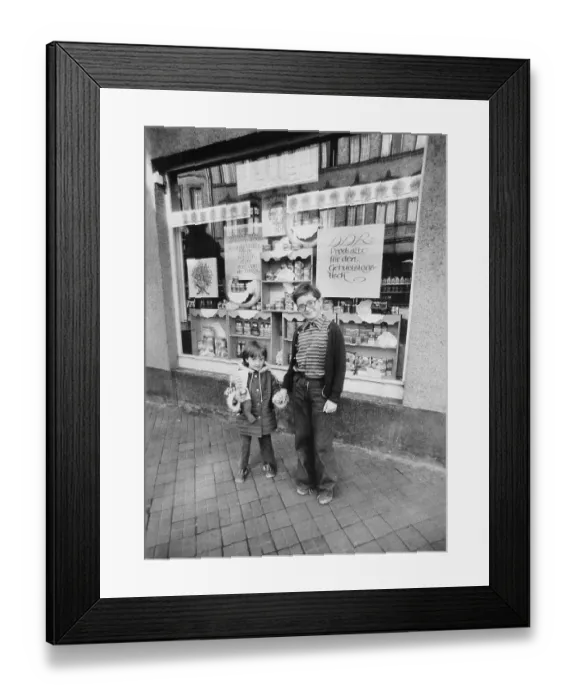 Framed Print : Children in front of a delicatessen with advertising for the anniversary of the Republic Framed Print : Children in front of a delicatessen with advertising for the anniversary of the Republic