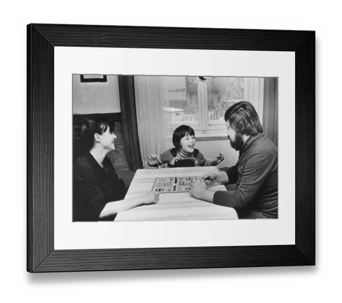 Framed Print : Family playing the Mensch-aergere-dich-nicht board game