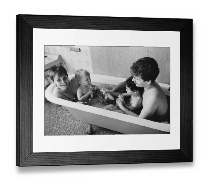 Framed Print : Young family in a bath tub, East Germany Framed Print : Young family in a bath tub, East Germany