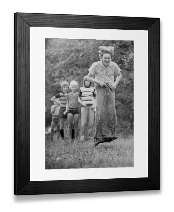 Framed Print : Children in a sack race, East Germany, around 1976 Framed Print : Children in a sack race, East Germany, around 1976