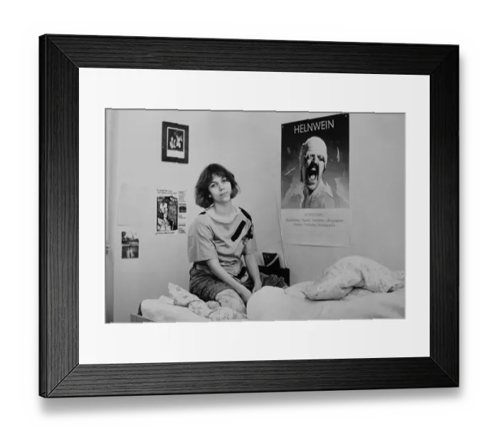 Framed Print : Young woman, student, with poster of Helnwein Framed Print : Young woman, student, with poster of Helnwein