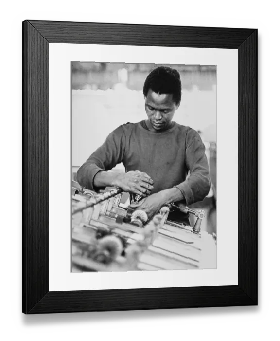 Framed Print : African apprentice, bookbinding shop