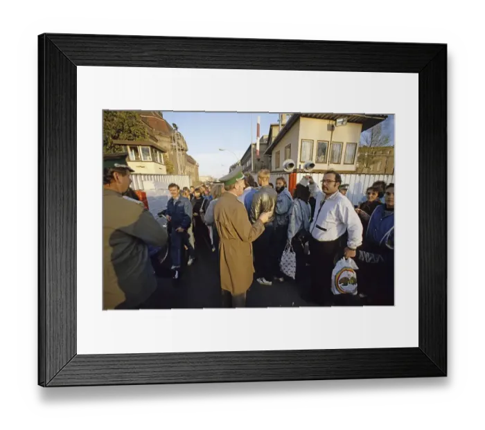 Framed Print : Fall of the Berlin Wall: citizens from East Berlin return with shopping bags at the border crossing Invalidenstrasse