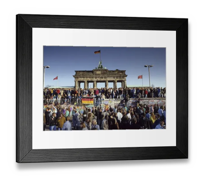 Framed Print : Fall of the Berlin Wall: people from East and West Berlin climbing on the Wall at the Brandenburg Gate Framed Print : Fall of the Berlin Wall: people from East and West Berlin climbing on the Wall at the Brandenburg Gate
