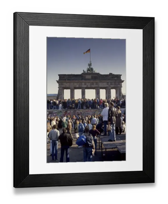 Framed Print : Fall of the Berlin Wall, people from East and West Berlin climbing on the Wall at the Brandenburg Gate Framed Print : Fall of the Berlin Wall, people from East and West Berlin climbing on the Wall at the Brandenburg Gate
