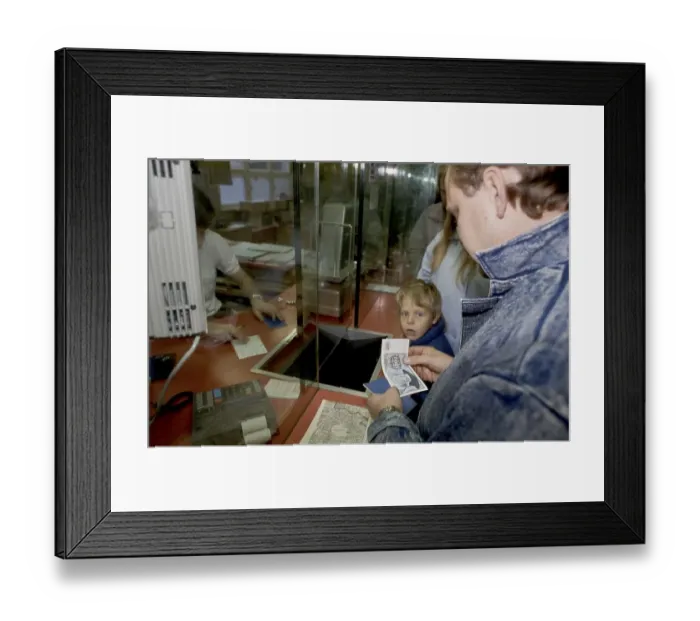 Framed Print : Fall of the Berlin wall, man from East Berlin receiving Begruessungsgeld