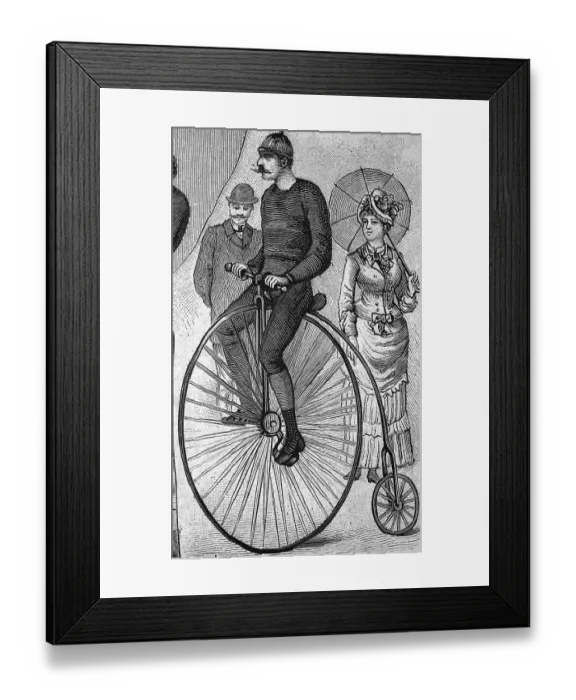 Framed Print : Man riding a Penny Farthing bicycle Framed Print : Man riding a Penny Farthing bicycle