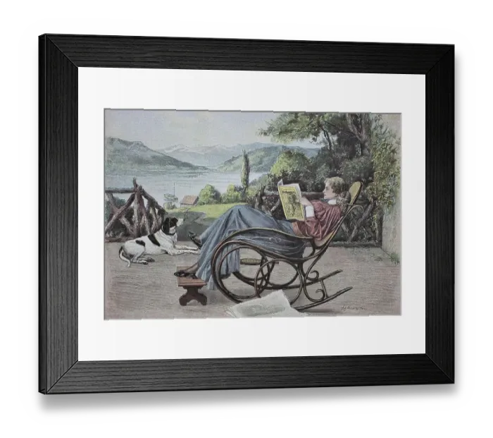 Framed Print : Woman reading a newspaper in a rocking chair