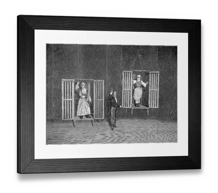 Framed Print : The illusionist Thorn demonstrates the appearance and disappearance of persons in cages