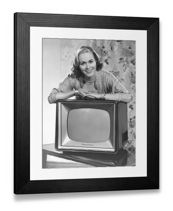 Framed Print : Woman posing with a television