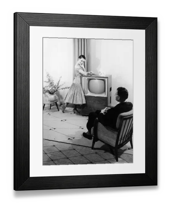 Framed Print : Woman posing in front of a TV set