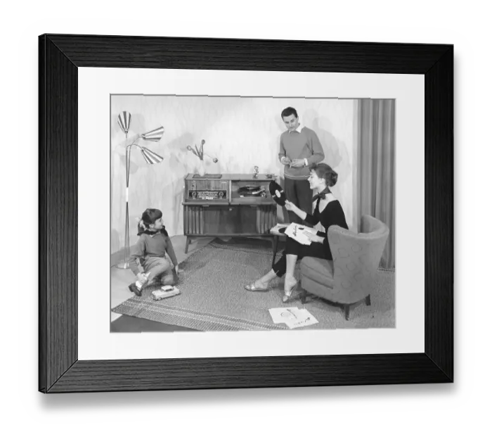Framed Print : Family in the living room in front of the stereo Framed Print : Family in the living room in front of the stereo