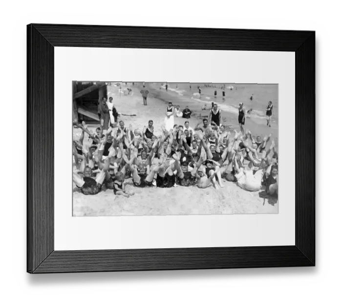 Framed Print : Group of people waving their feet in the air