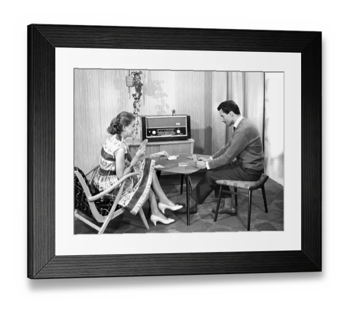 Framed Print : Couple playing cards in the living room
