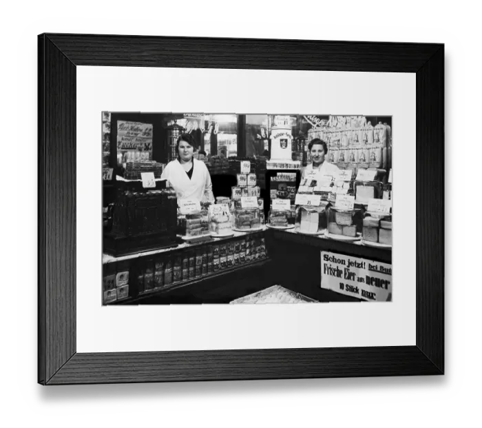 Framed Print : Two saleswomen standing behind the counter Framed Print : Two saleswomen standing behind the counter