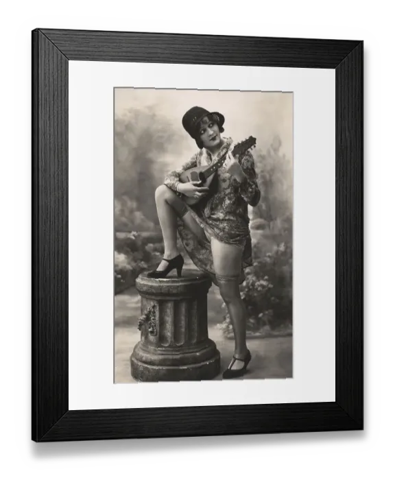 Framed Print : Woman playing plucking instrument