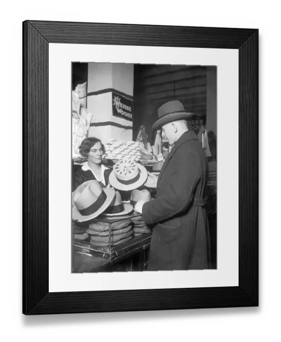 Framed Print : Man buying a hat, historical photo, circa 1920 Framed Print : Man buying a hat, historical photo, circa 1920