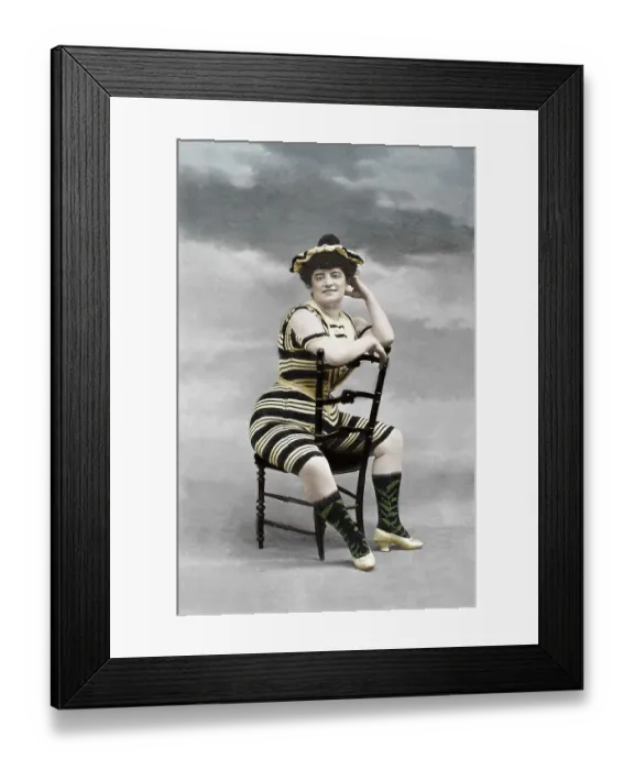 Framed Print : Woman in a corsett sitting on a chair