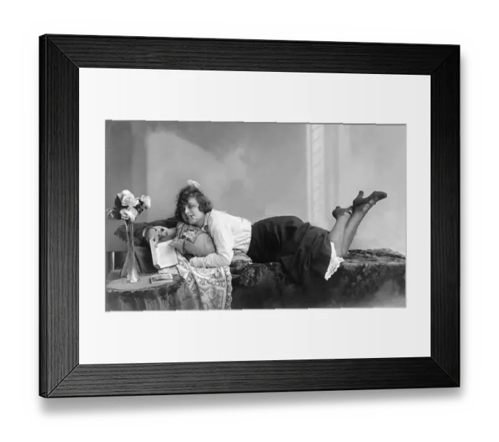 Framed Print : Woman reading and smoking on a divan Framed Print : Woman reading and smoking on a divan